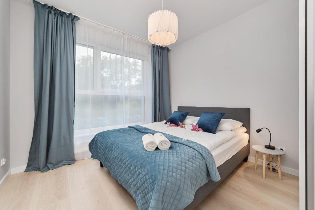 Posteľ alebo postele v izbe v ubytovaní Central SouthStar Apartments - Gwiaździsta - FREE PARKING by Noclegi Renters