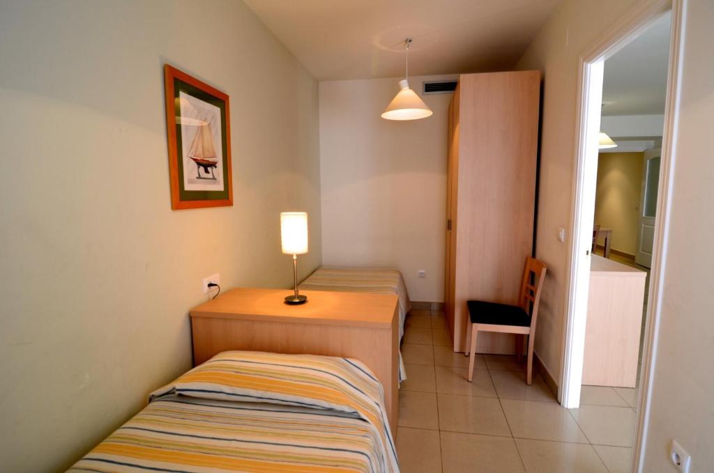 Posteľ alebo postele v izbe v ubytovaní Mestral - apartamentos céntricos