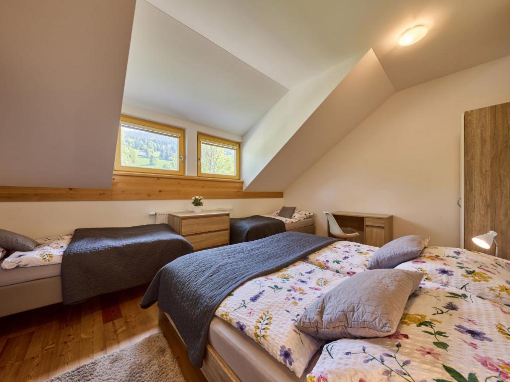 Postel nebo postele na pokoji v ubytování Apartment Ski-In Ski-Out Mountain Duplex Portášky2 by Interhome