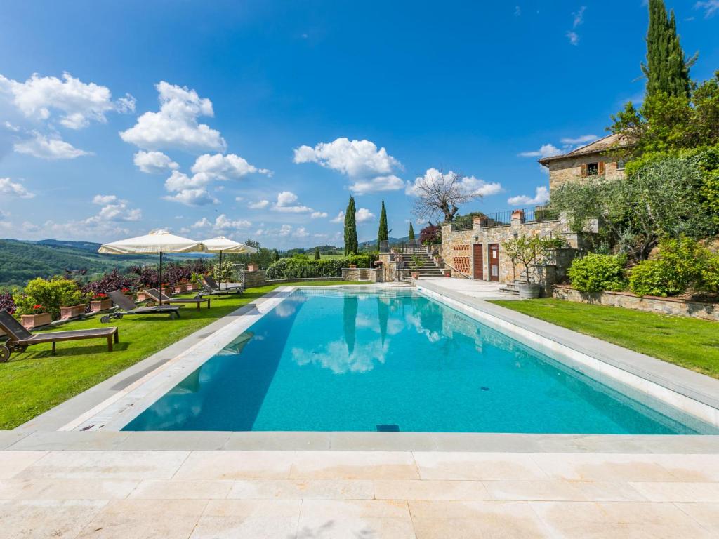 a swimming pool in the backyard of a villa at Holiday Home Lamore di Carla by Interhome in Greve in Chianti