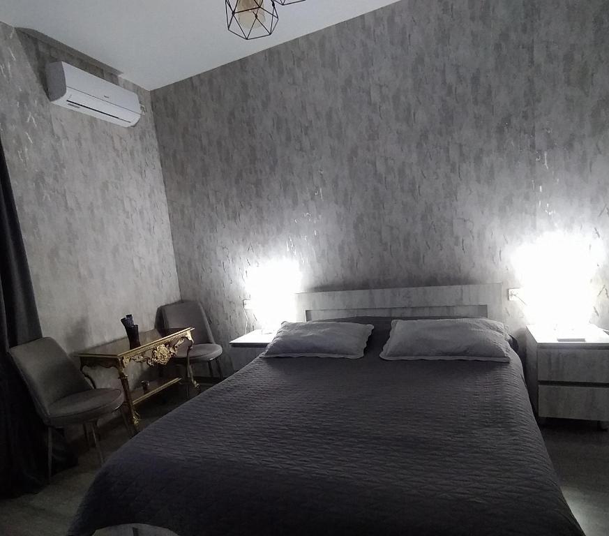 Postel nebo postele na pokoji v ubytování Guest House Mtisubani