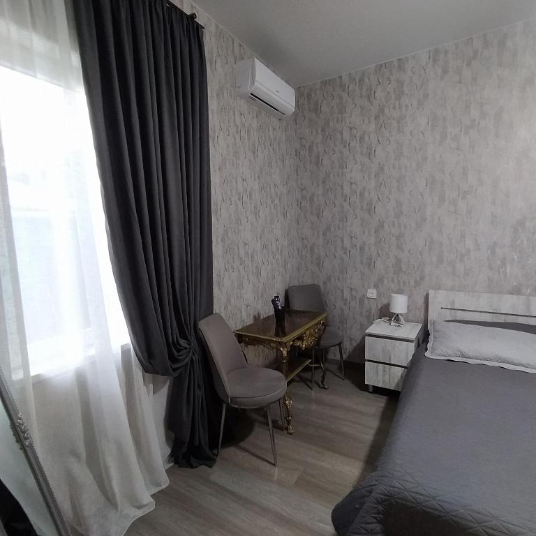 Postel nebo postele na pokoji v ubytování Guest House Mtisubani
