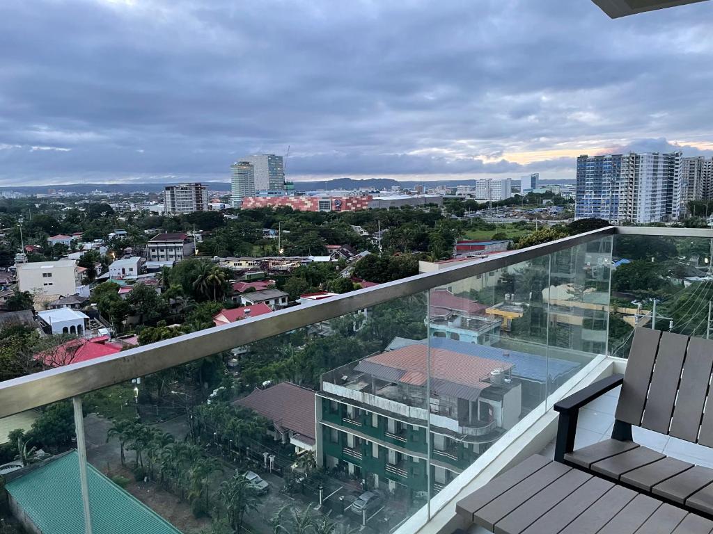 a view of a city from the balcony of a building at S & E Condo with Panoramic View in Iloilo City