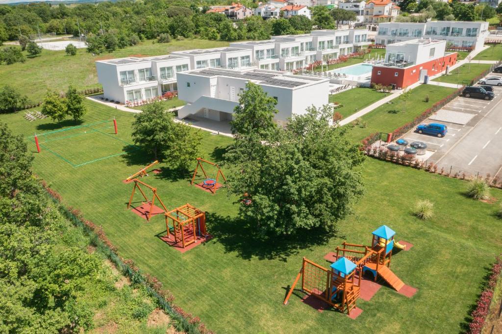 an aerial view of a park with a playground at Maj Luxury Residence in Poreč