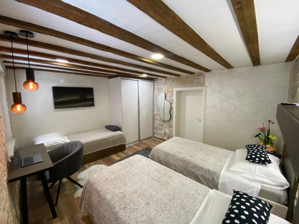 Postel nebo postele na pokoji v ubytování Guest House Laura