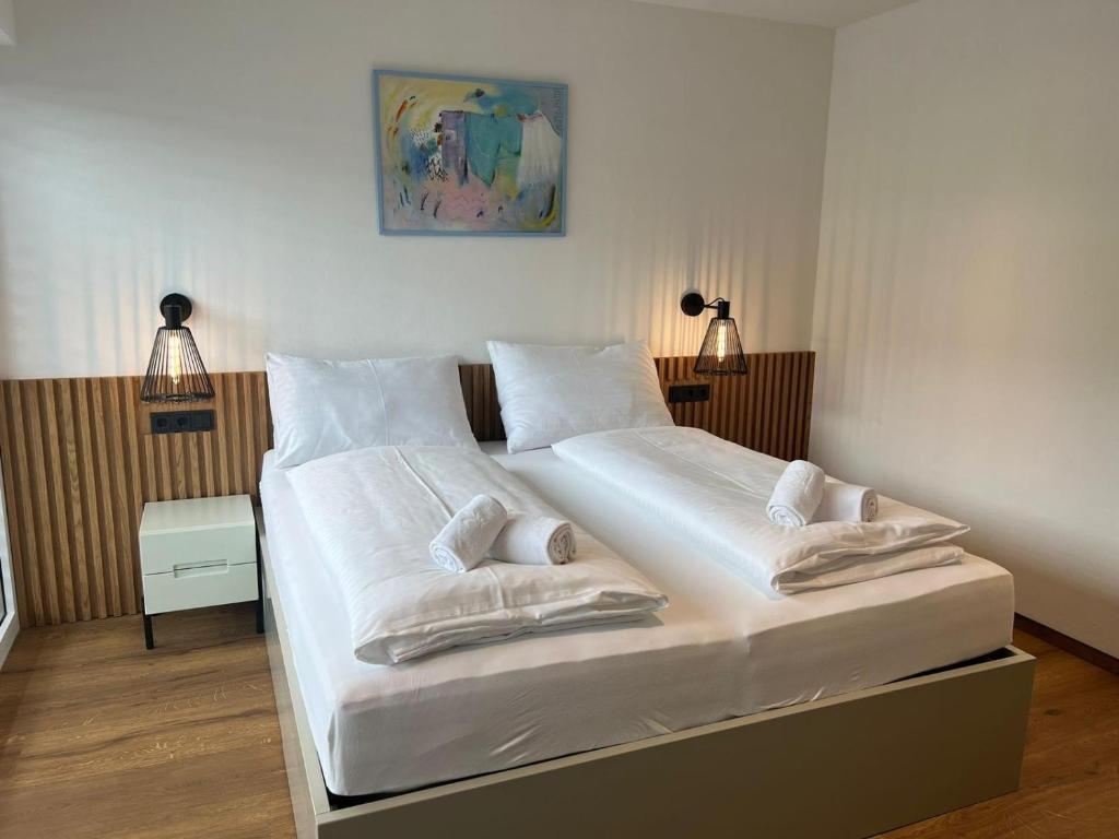 A bed or beds in a room at Apartment MAJA by Krone Travel Agency