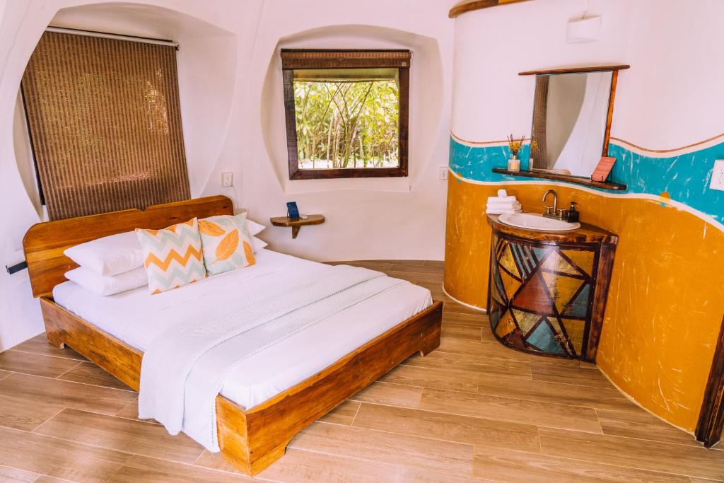 Katil atau katil-katil dalam bilik di Bambuda Lodge