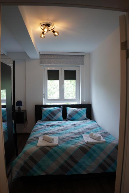 Postel nebo postele na pokoji v ubytování Royal Apartmani