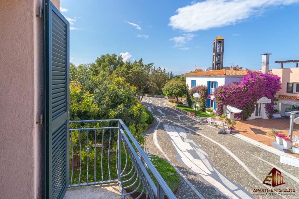a view of a street from a balcony of a building at Porto Rotondo Central House in Porto Rotondo