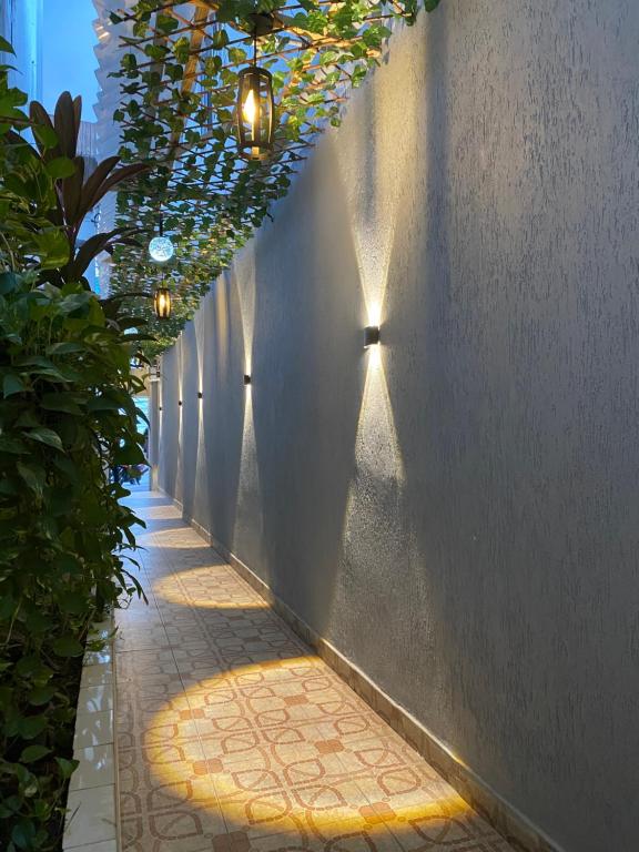 a hallway with lights on the side of a building at AL HAMRA in San Andrés