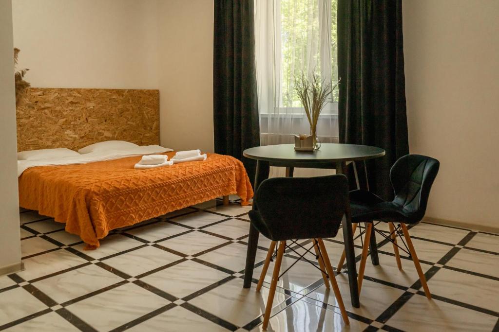 Postel nebo postele na pokoji v ubytování TREND HOUSE Apartments