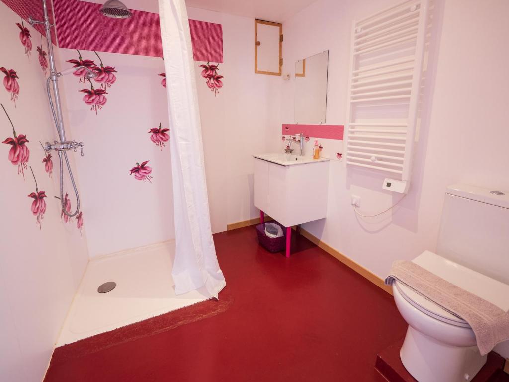 a bathroom with a toilet and a sink and a shower at Yourtissimo in Laprugne
