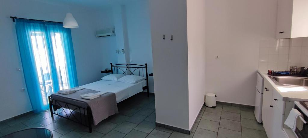 Postel nebo postele na pokoji v ubytování Ammonitis