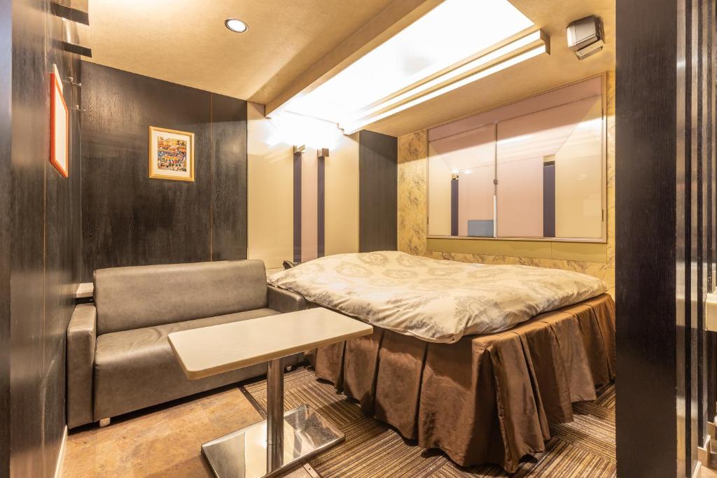 Postel nebo postele na pokoji v ubytování リトルドルフィン岐阜 -大人専用-