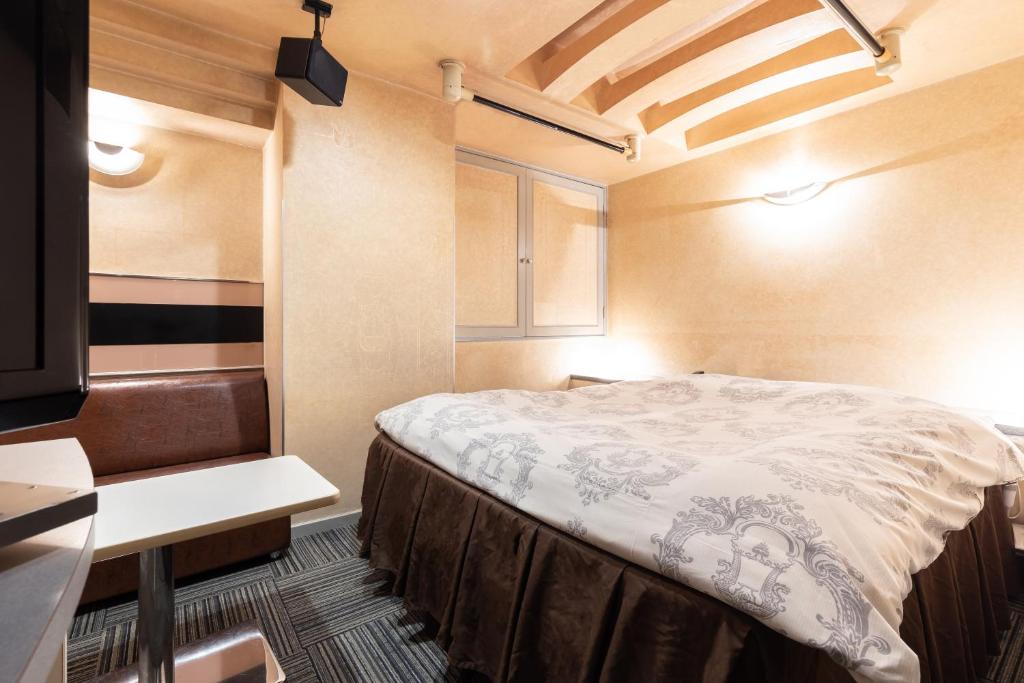 Postel nebo postele na pokoji v ubytování リトルドルフィン岐阜 -大人専用-