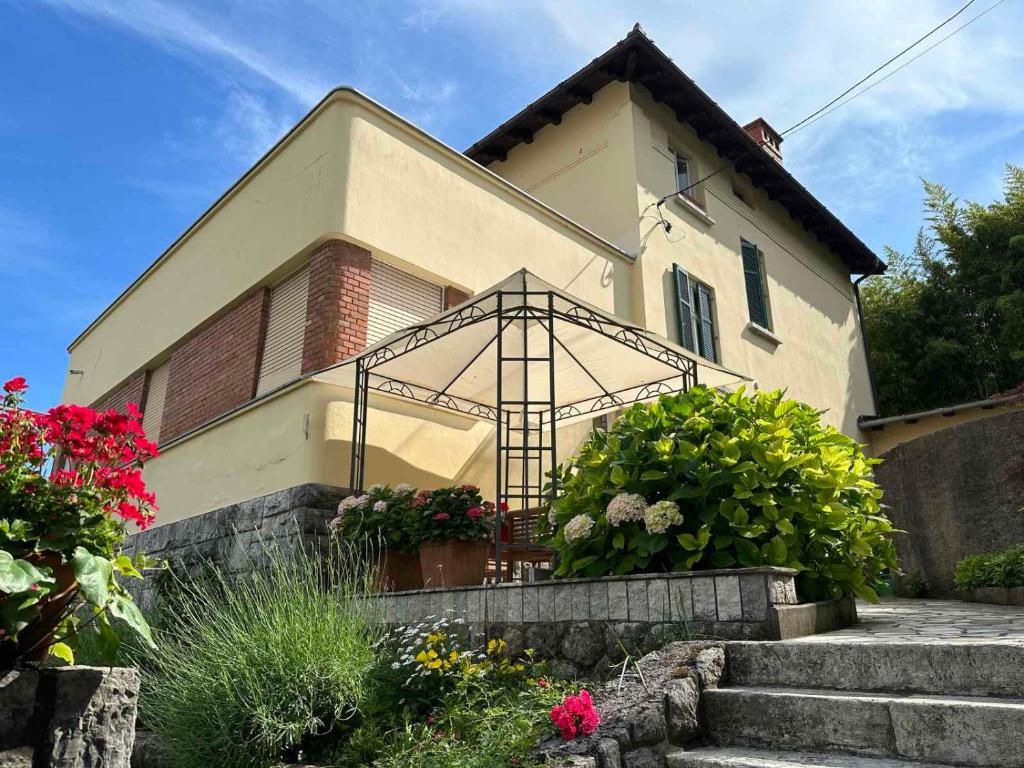 a house with a gate in front of it at Apartments Galatea with garage parking in Opatija