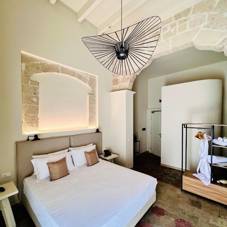 Postel nebo postele na pokoji v ubytování Palazzo Matà Boutique Hotel