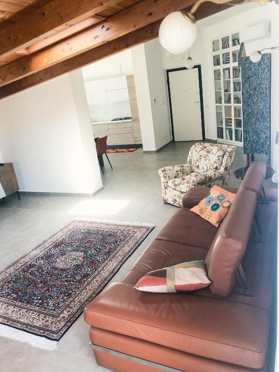 Posezení v ubytování "La casa di Ale" MODERN SUITE