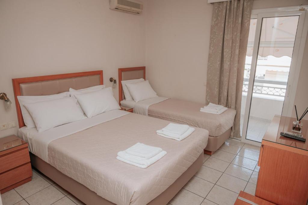 Postel nebo postele na pokoji v ubytování Hotel Hermes Pieria