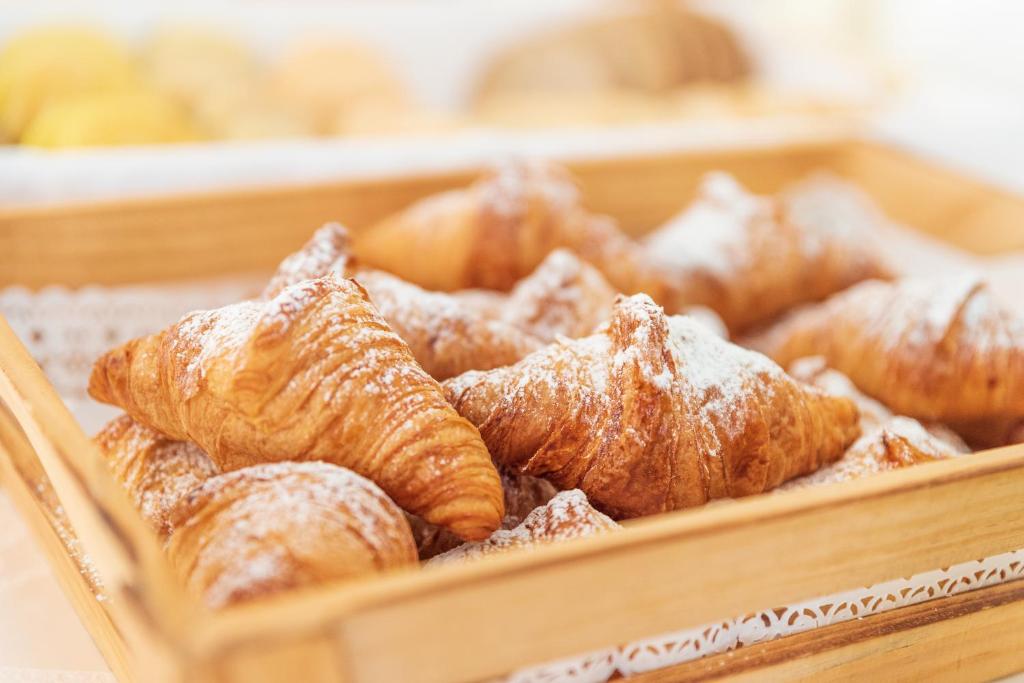 a tray of croissants and other pastries at Hotel Everest in Bellaria-Igea Marina