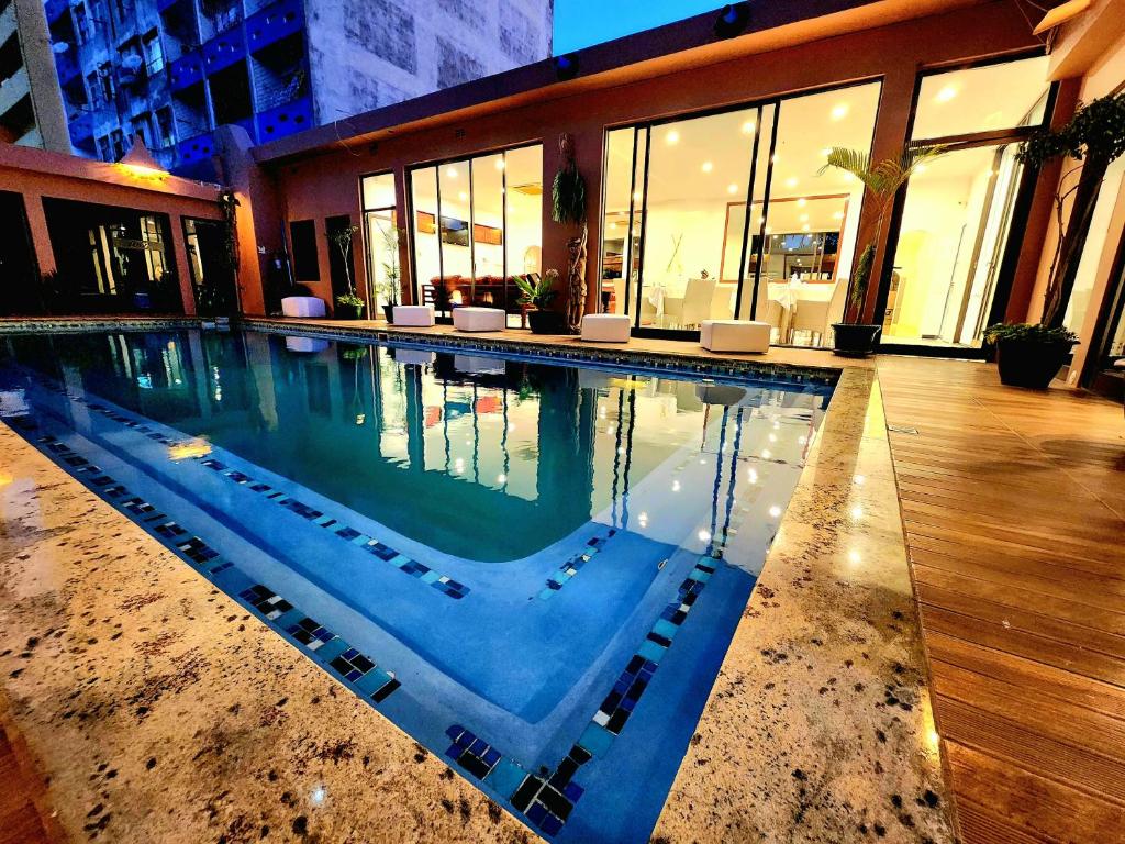 a swimming pool in the middle of a building at Villa das Arábias Boutique Hotel in Maputo