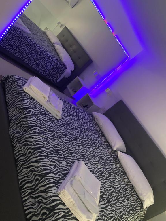 Postel nebo postele na pokoji v ubytování Visavi' Luxury Room