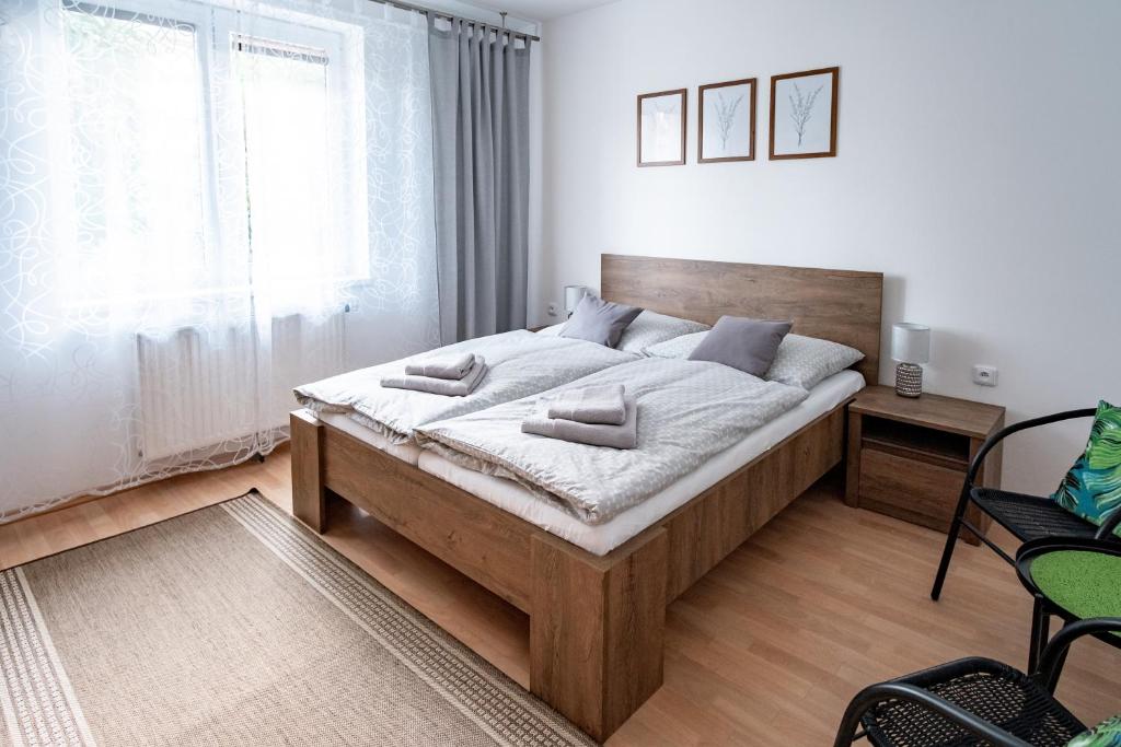 Postel nebo postele na pokoji v ubytování Apartmány TriMM