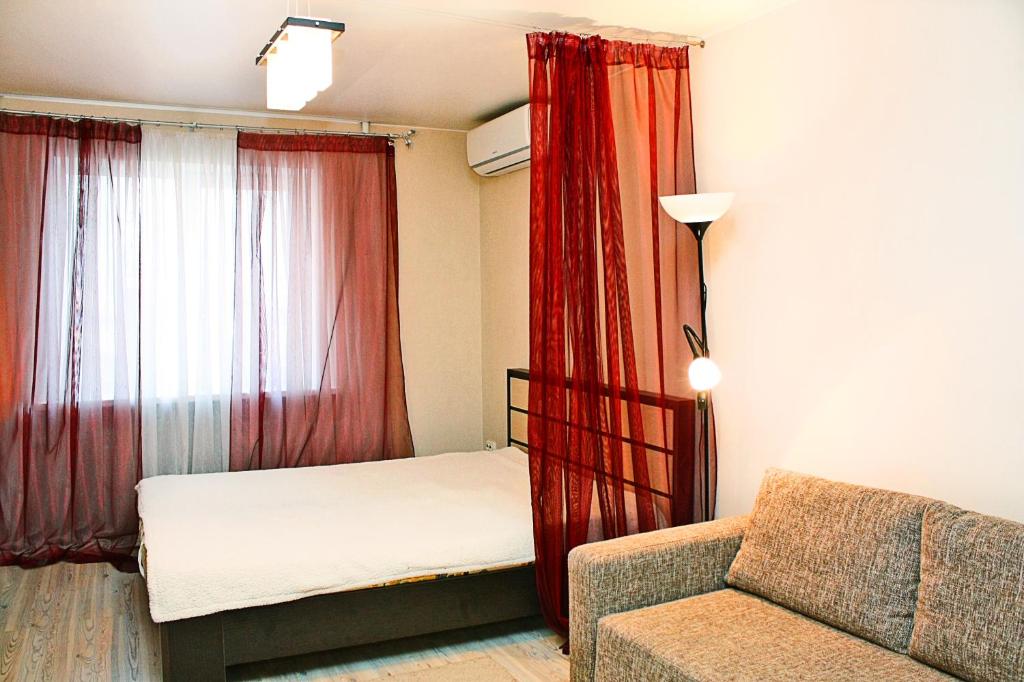Llit o llits en una habitació de Alliance Apartments na Gazetnom