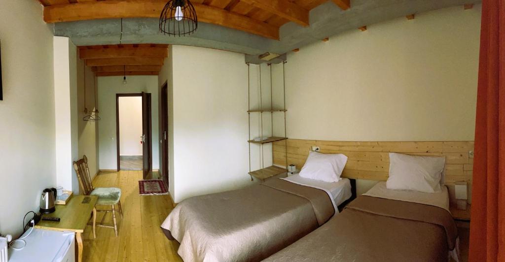 Postel nebo postele na pokoji v ubytování Hotel Ailama Mestia