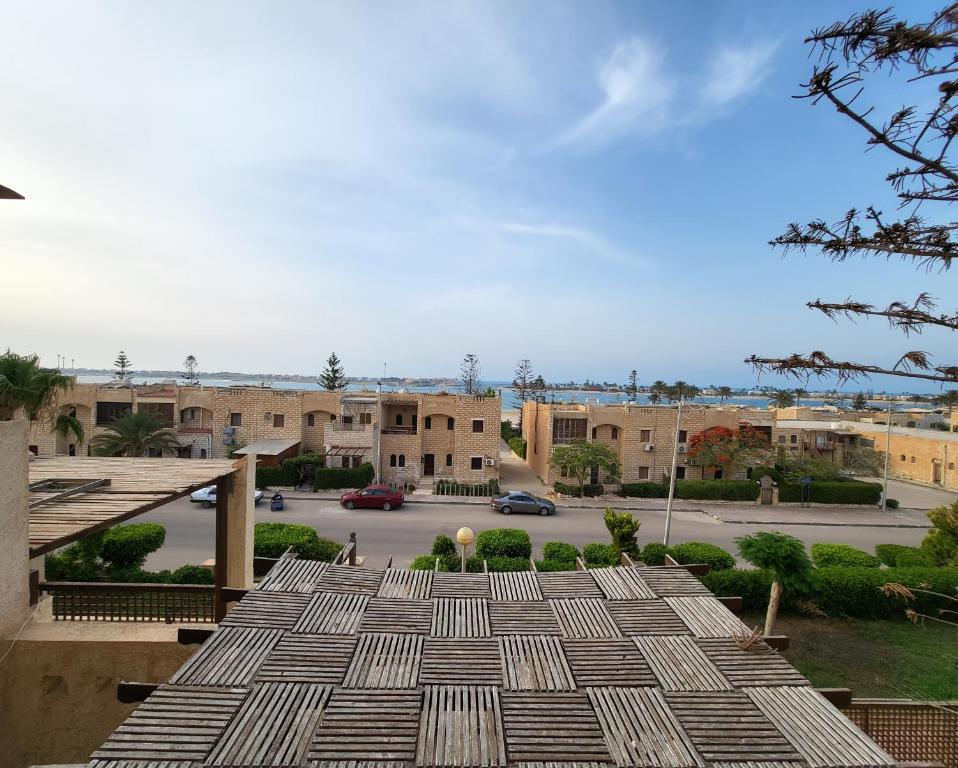 a view from the roof of a building with a parking lot at Lake & Sea View Duplex in Marina 2 in El Alamein