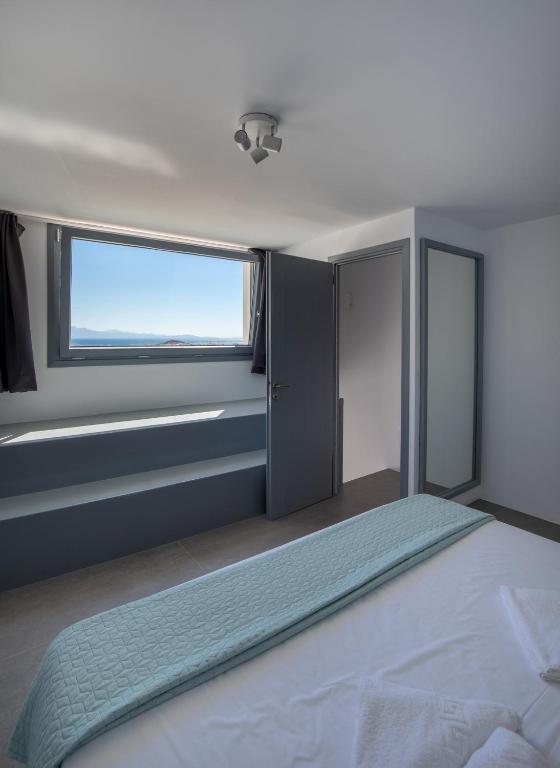 Postel nebo postele na pokoji v ubytování Lectus Mykonos