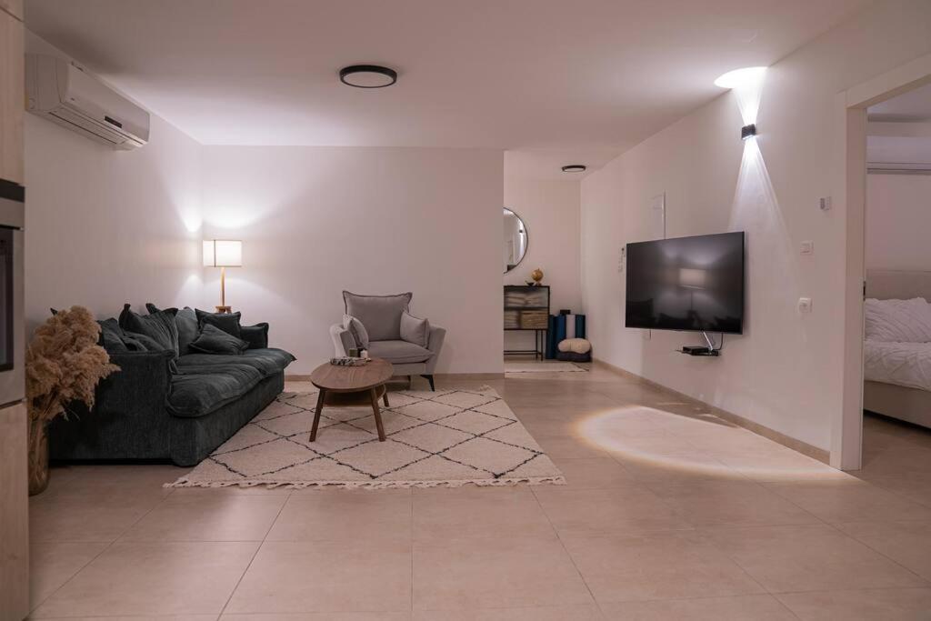 TV a/nebo společenská místnost v ubytování Migdalor