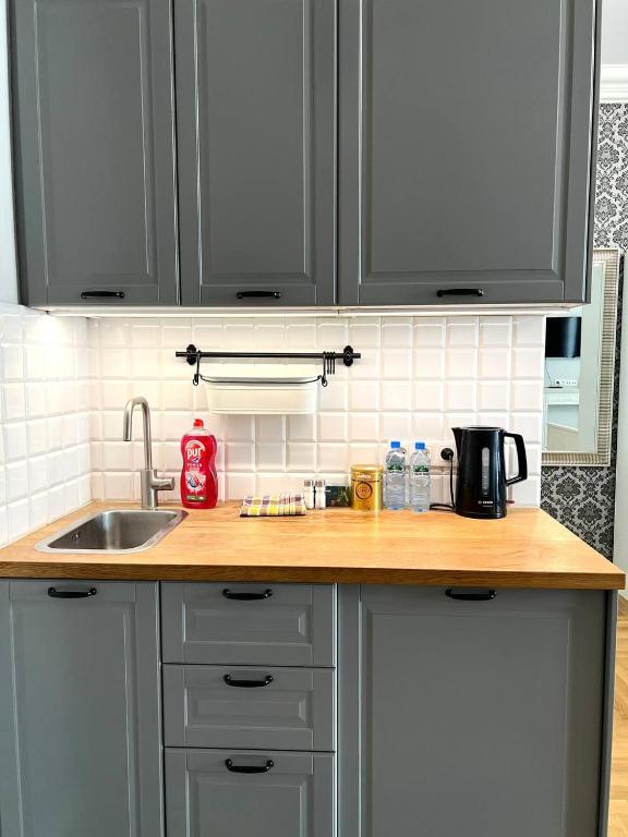 a kitchen with a sink and a counter top at Top Apartment In The Centre Of Warsaw, Wi-Fi - by HIK Apartments in Warsaw