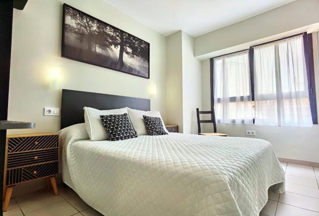 Postel nebo postele na pokoji v ubytování HOSTAL RIGAU