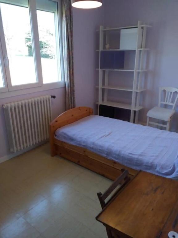 Cama ou camas em um quarto em La maison d&#39;Ormancey