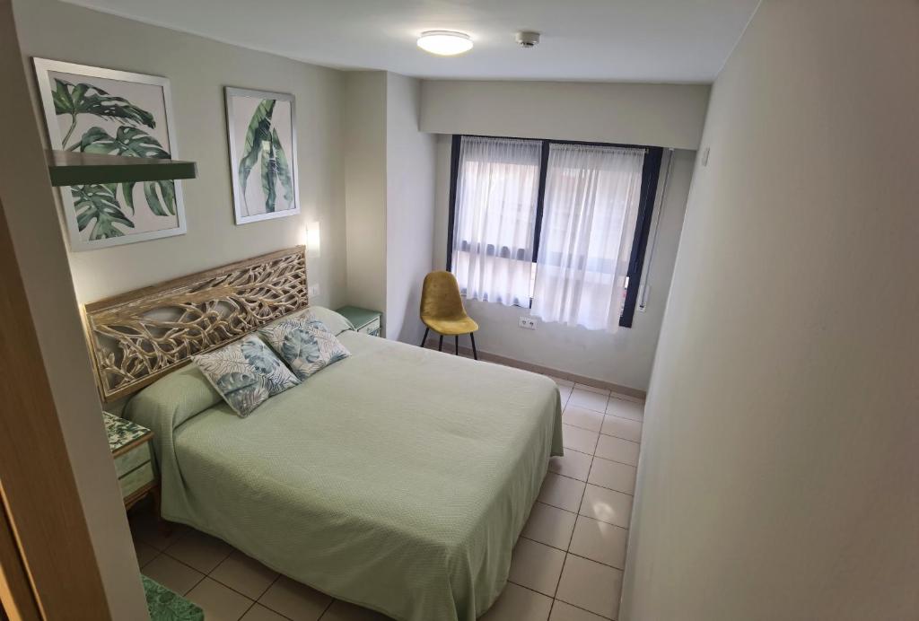Postel nebo postele na pokoji v ubytování HOSTAL RIGAU