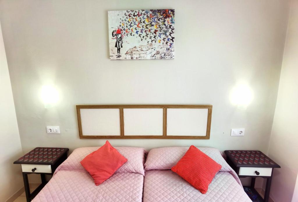 Postel nebo postele na pokoji v ubytování HOSTAL RIGAU
