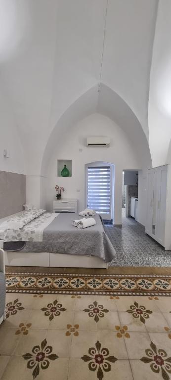 Postel nebo postele na pokoji v ubytování Amarcord