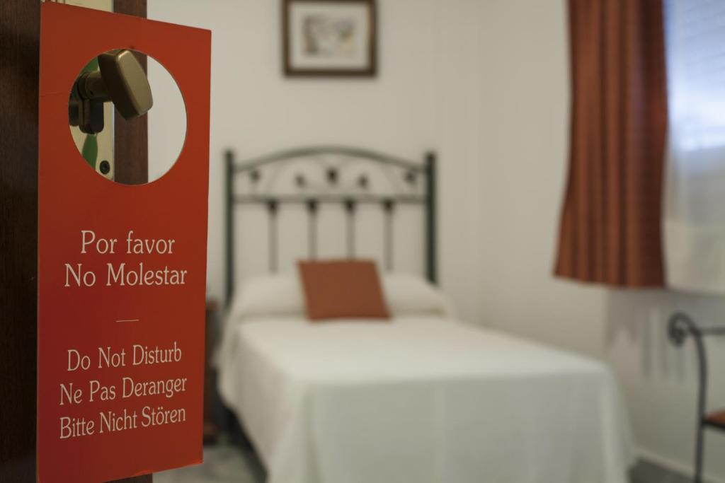 Łóżko lub łóżka w pokoju w obiekcie Hotel La Parrita