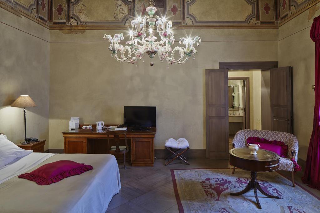 Postel nebo postele na pokoji v ubytování Albergo Cappello