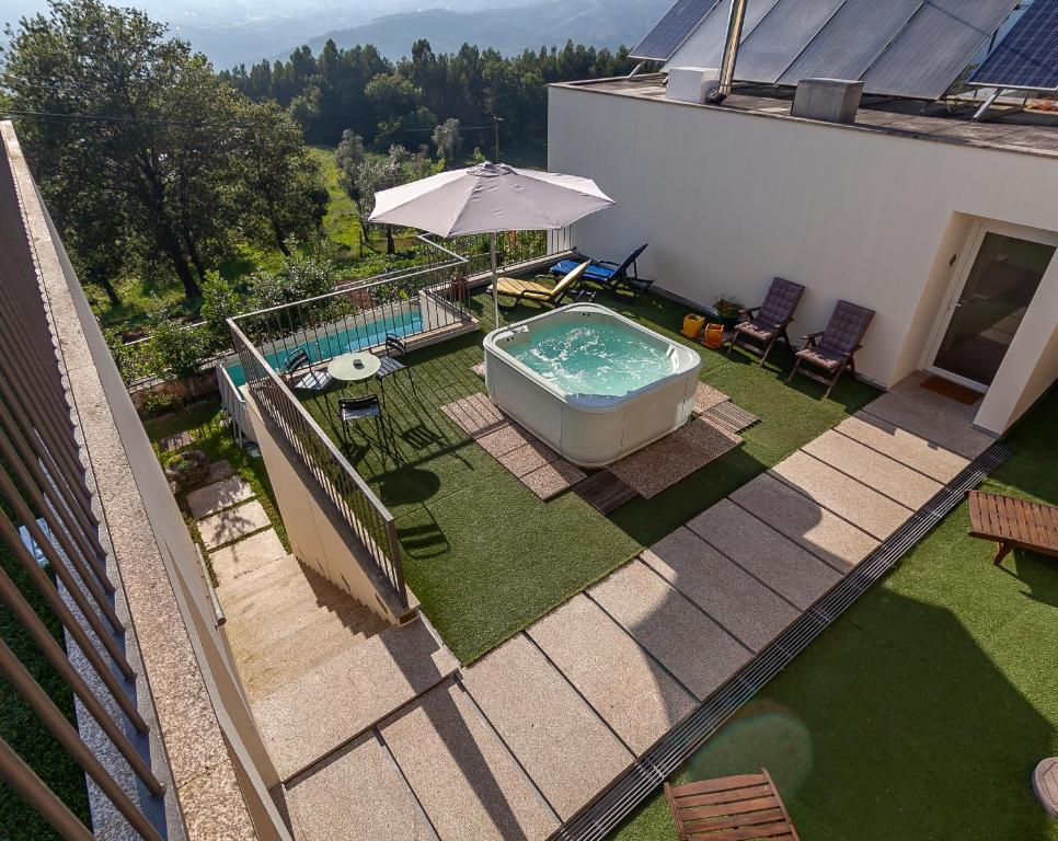an overhead view of a backyard with a hot tub at Villa Redouça in Cedrim