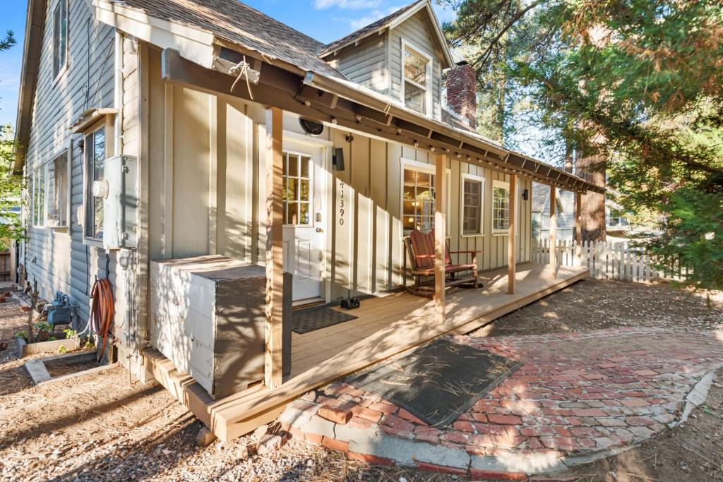 a home under construction with a front porch at Happy Hours - Modern Cabin with Game Room and Peek-a-Boo Lake Views! in Big Bear Lake