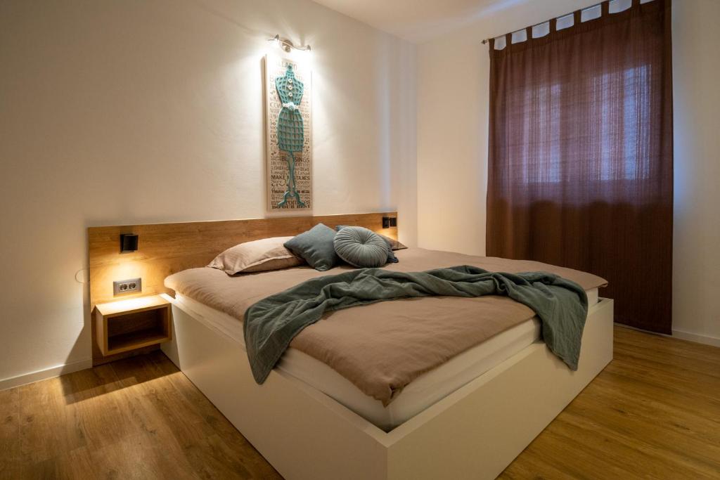 Posteľ alebo postele v izbe v ubytovaní Lea Apartments