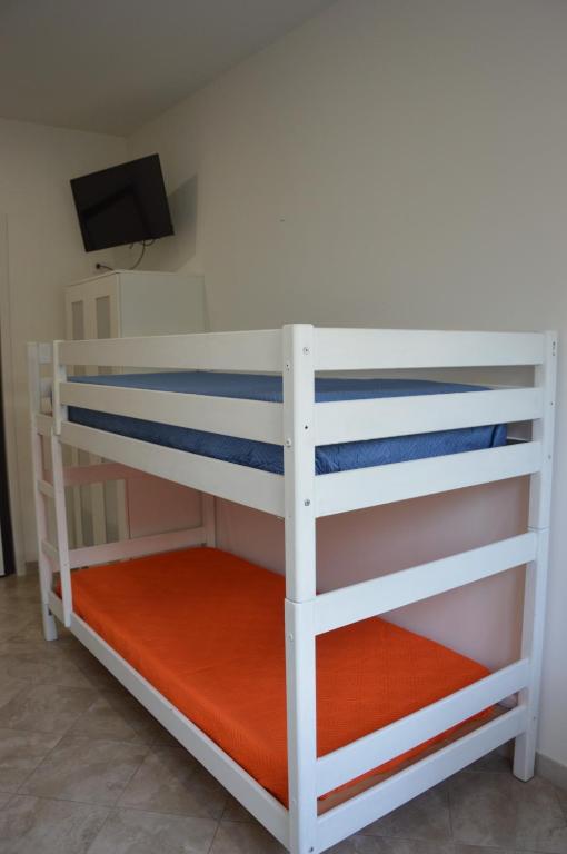 Postel nebo postele na pokoji v ubytování B&B il MENHIR