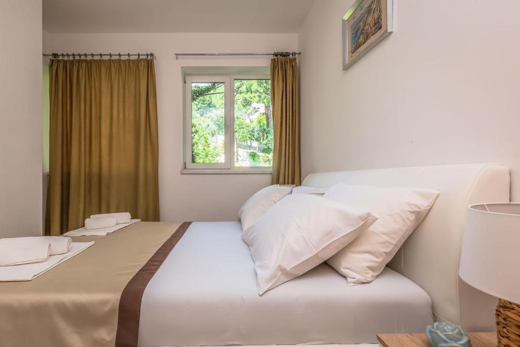 Postel nebo postele na pokoji v ubytování Motel Ljetni raj