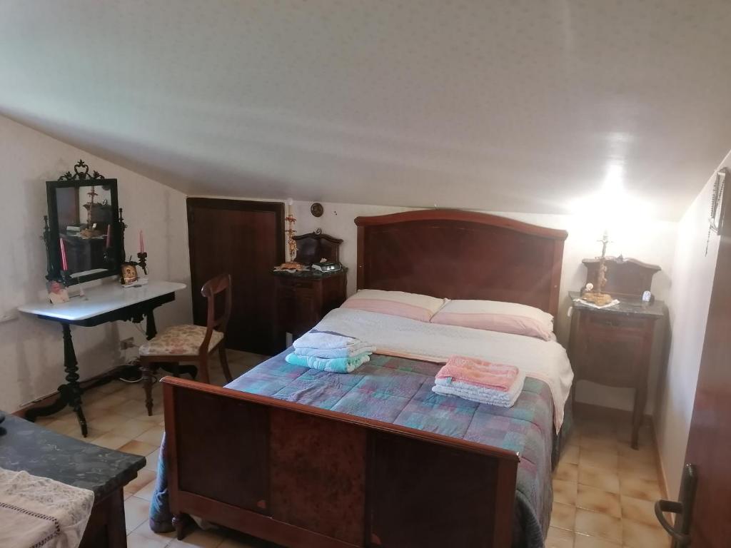 Postel nebo postele na pokoji v ubytování Luciano e Concetta