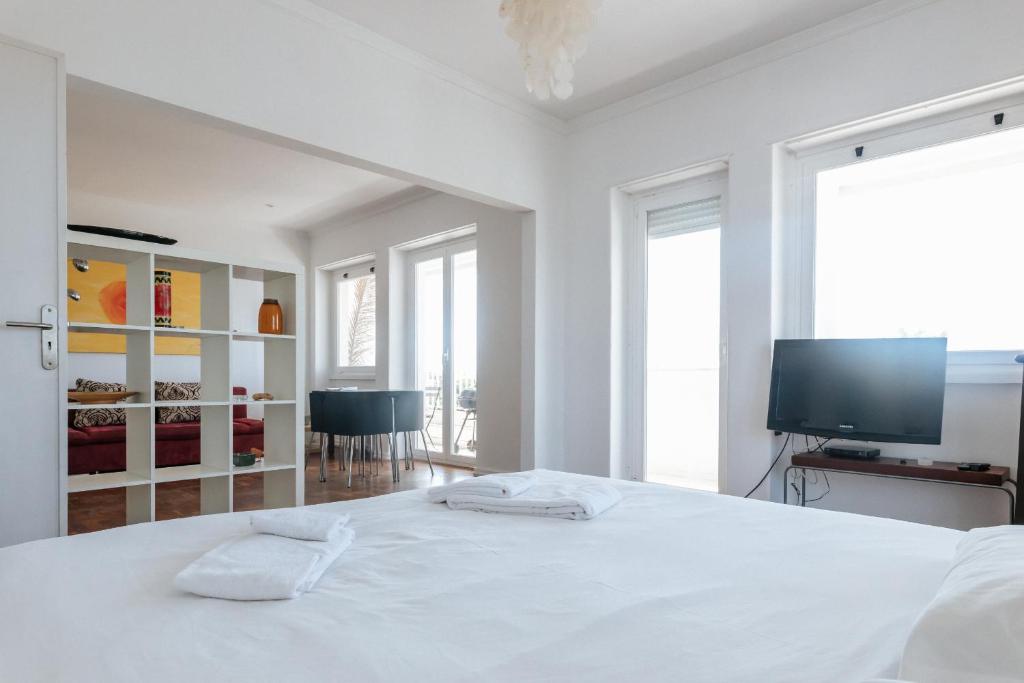 Postel nebo postele na pokoji v ubytování Cascais - Carcavelos Beach Apartment