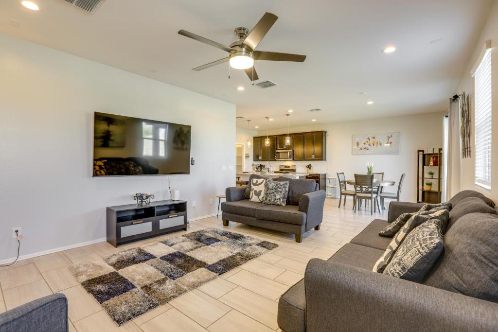a living room with a couch and chairs and a table at Spacious Avondale Home with Patio and Pool Access! in Avondale