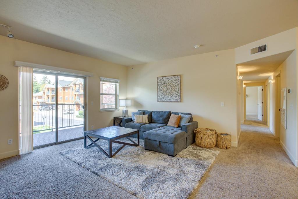a living room with a couch and a table at Coeur dAlene Vacation Rental 4 Mi to Hayden Lake in Coeur d'Alene