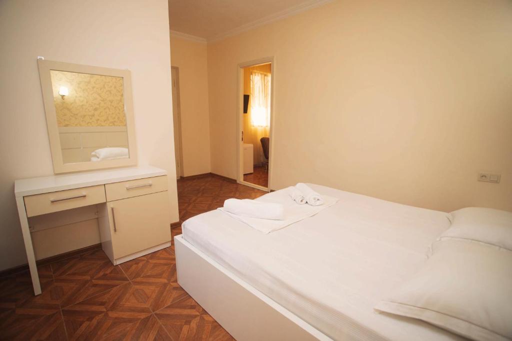 Ένα ή περισσότερα κρεβάτια σε δωμάτιο στο Hotel Irise